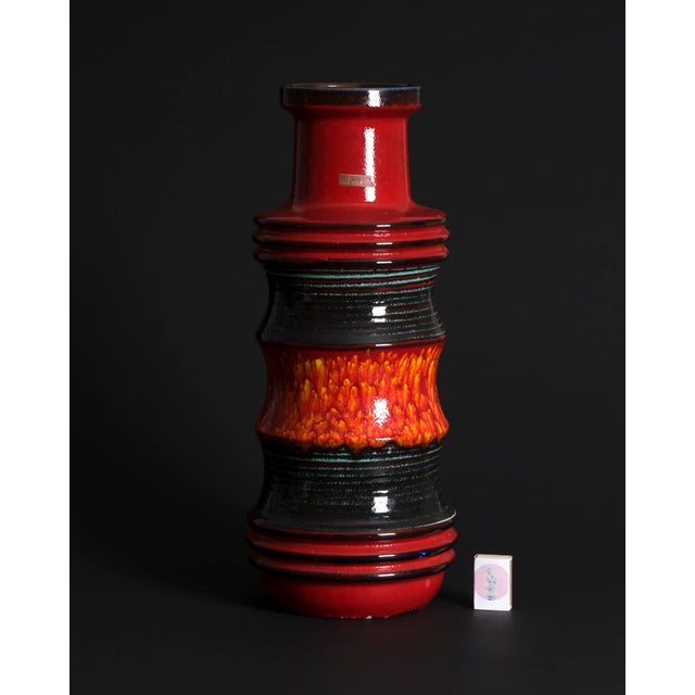 Large ceramic floor vase from Scheurich’s “Pagoda” series, finished in a vivid Fat Lava glaze shifting from lava black to...