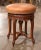 Elegant and practical, this antique piano stool offers graceful Louis XV styling and an adjustable seat. Crafted in...