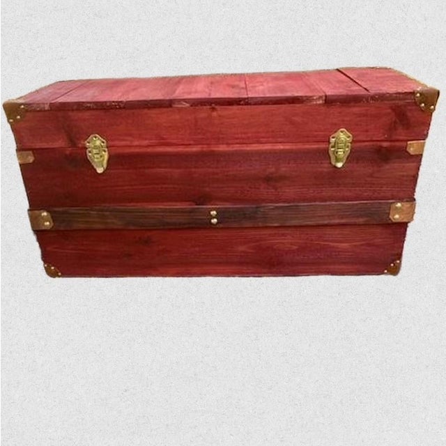 One of a kind hand crafted steamer trunk. Beautifully stained a snappy barn red with copper and brass trunk clamps....