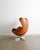 A very rare and beautiful example of an iconic danish mid century "3317 / egg" armchair in original cognac brown leather...