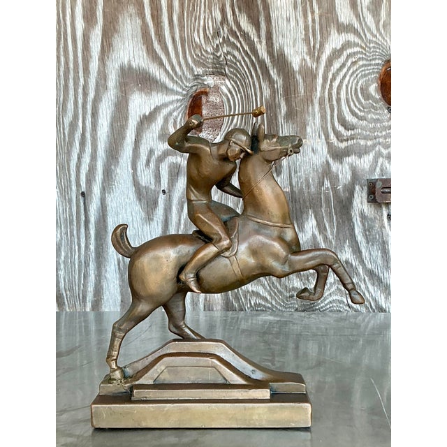 Bold and full of motion, this vintage Boho brass sculpture captures the dynamic intensity of a polo rider in mid-swing....