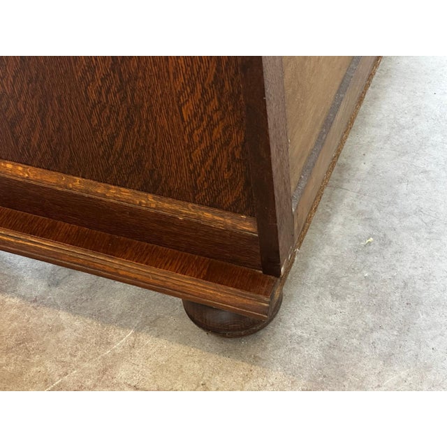 Sidney: Mid-Century vintage oak and veneer chest of drawers, featuring four large drawers offering ample storage. This...