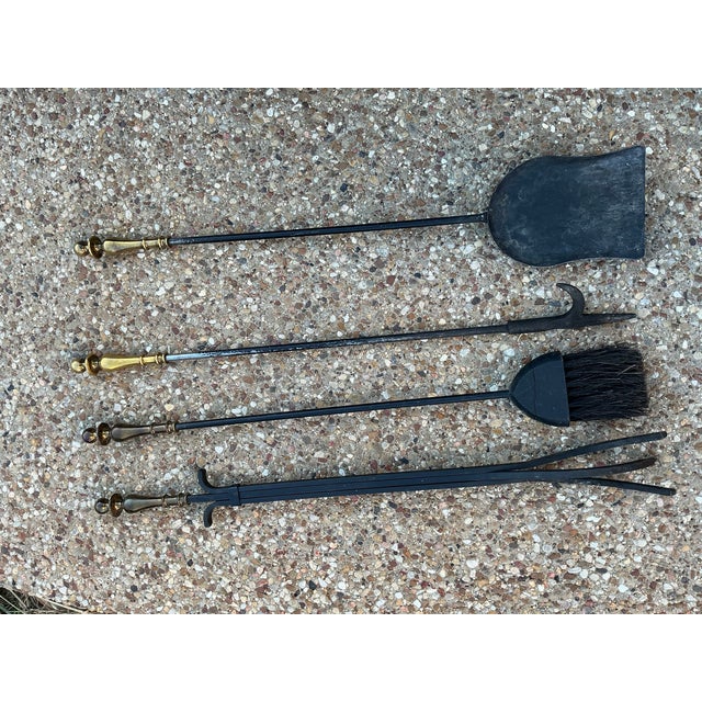 A classic vintage fireplace companion set by Pilgrim, crafted with the company's signature combination of durable black...