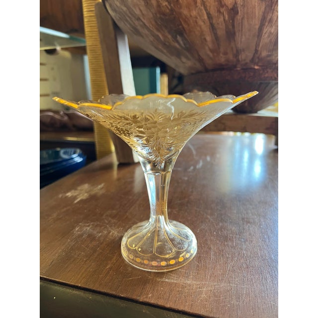 19th century glass bonbon dish or compote. Features: Pedestal base, scalloped edge, gold floral decoration.