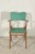 Chair with armrests, solid wood frame and seat with back in green leatherette pintiricchiata black edging italy 1960...
