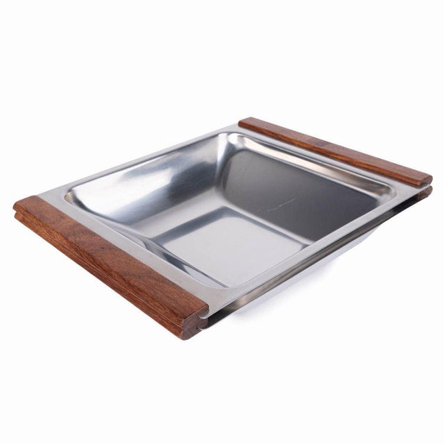Stainless steel serving trays most probably produced in the 1960s by Kalmar Designs. They are square in shape and have...