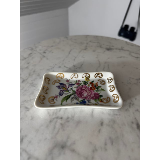 A beautifully preserved vintage mid-century French porcelain trinket dish / vanity catchall tray crafted by the historic...