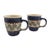 A duet of delight, these hand-painted Polish stoneware mugs sing in cobalt and cream. Delicate florals bloom in golden...