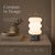 This cordless table lamp combines modern design with soft, comfortable lighting. The shade is crafted from opal glass,...
