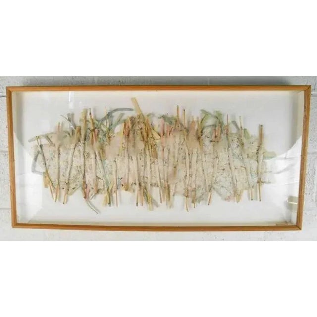 This unique art piece combines several mediums in a delicate collage of organic materials. Please confirm item location,...