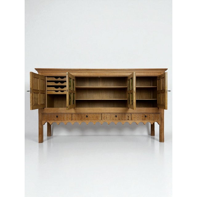 Large Danish Sideboard in Oak by Henning Kjærnulf, 1960s, in Good conditions. Designed 1960 to 1969 This piece has an...