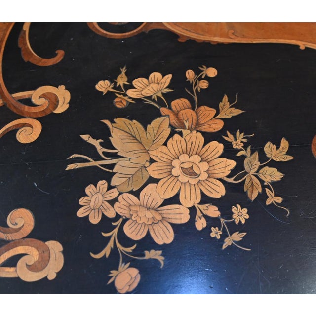 Victorian round walnut table with fine quality marquetry panels terminating on a triple cabriole leg base Circa 1860...