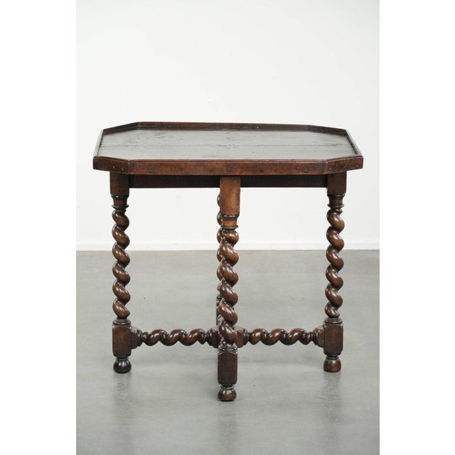 This very special antique English walnut side/center table features beautiful turned legs and an octagonal top. It dates...