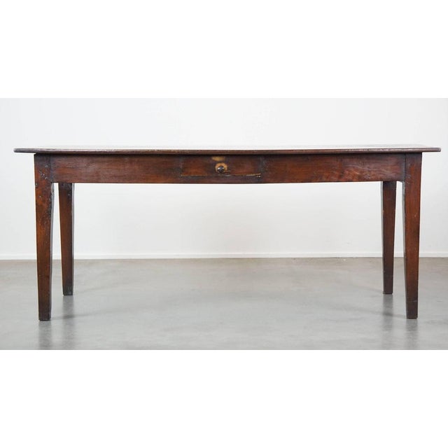 Very beautiful antique French fruit tree wooden dining table with 2 drawers and a beautiful patina. This great antique...