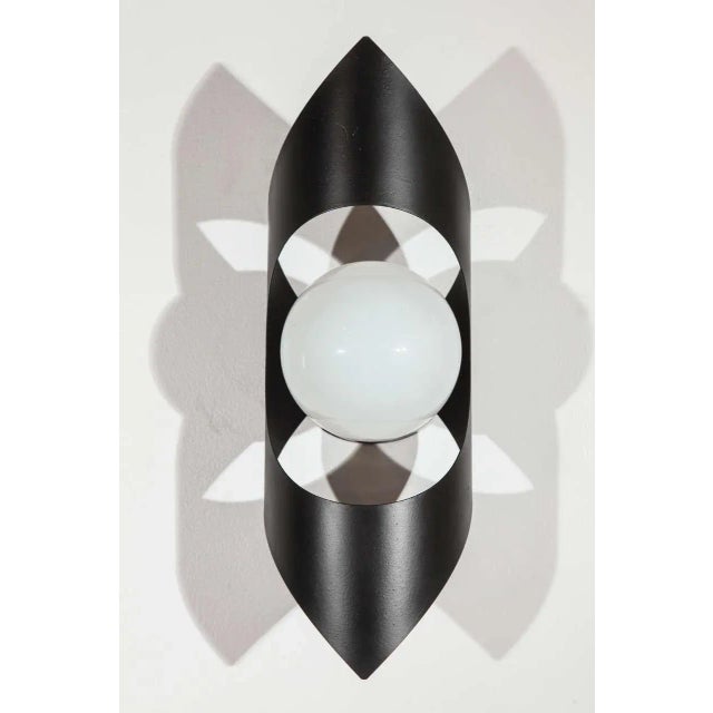 Pair of newly rewired black, vintage metal wall sconces from the 1970's. The pointed and curved vintage sconces are in...