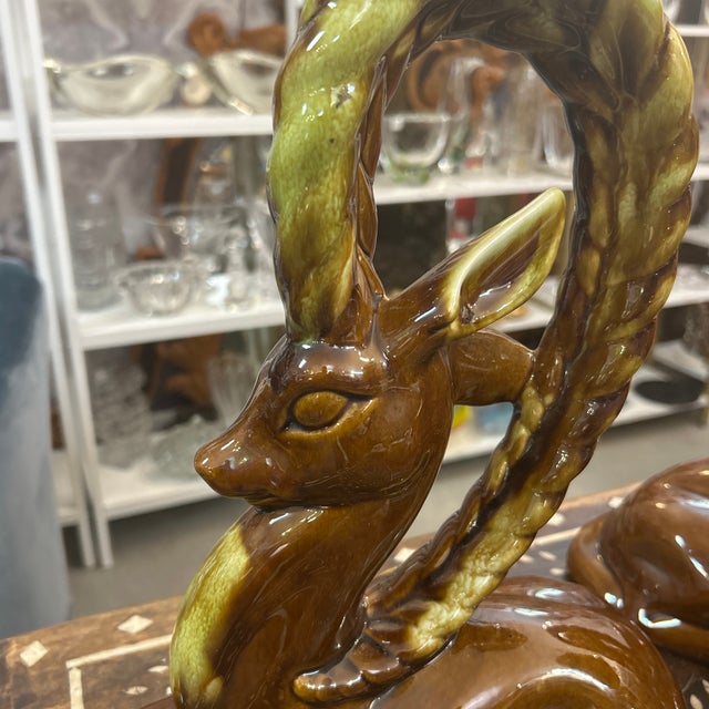 Great pair of period-made 1950s decorative ceramic ibex or gazelles. Their posing is regal and very really attractive....