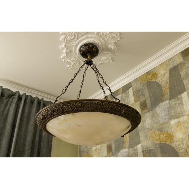 Large french art deco alabaster chandelier, circa 1920s. impressive xxl chandelier featuring a monumental alabaster bowl...