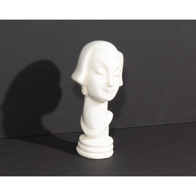 An Art Deco ceramic bust produced by AMACO (American Art Clay Company) of Indianapolis. This bust depicts an elegant woman...