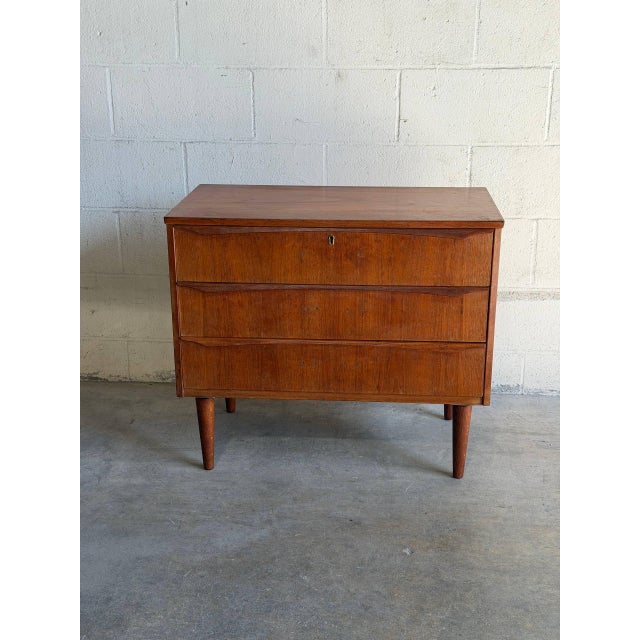 Beautiful vintage Danish Modern 3-drawer chest crafted in teak, made in Denmark. This compact Scandinavian modern dresser...