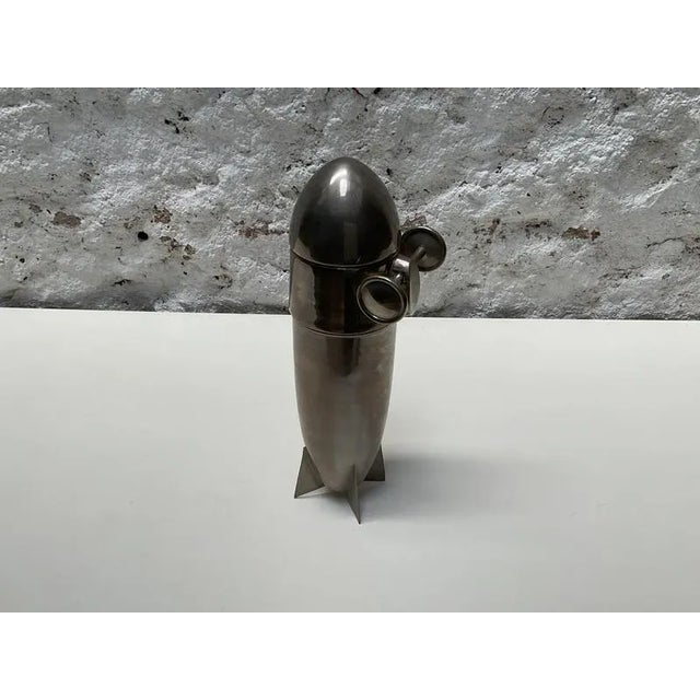 Rare art deco zeppelin-shaped cocktail shaker, crafted in chrome-plated and silvered metal in central europe around 1940....