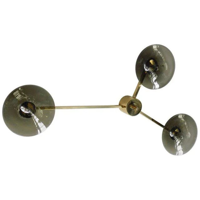 Italian flush mount with three smoky Murano glass shades mounted on solid brass frame in polished brass finish / Made in...