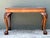 This elegant vintage coffee table is a sophisticated tribute to 18th-century Chippendale design, blending classical...