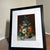 Beautiful vintage floral still life painting featuring a vibrant bouquet of multicolored flowers arranged in a decorative...