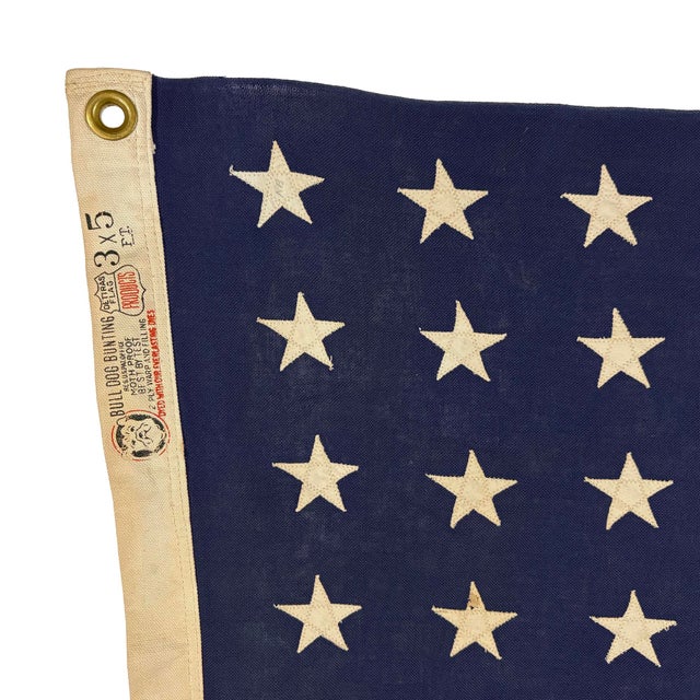 This vintage American flag is made from a cotton cloth with fully sewn stars and stripes. Please note overall...