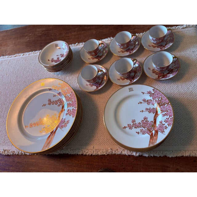 Exquisite vintage fine china set featuring hand-painted gilded Cherry blossoms. The set includes 6 each of the following:...