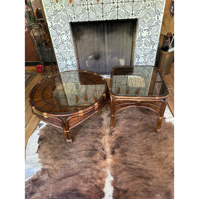 Offering a set of two rattan and split reed side tables made in the style of Franco Albini. They have excellent coloring...