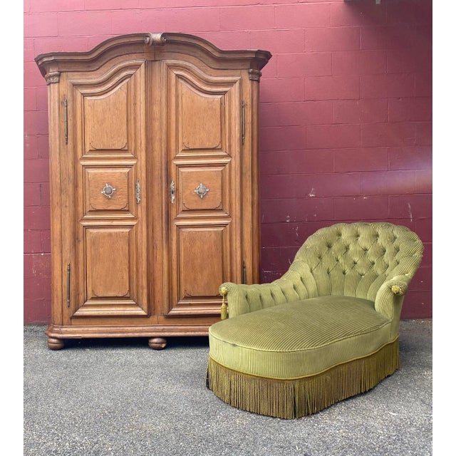 This striking solid oak armoire from France, dating back to the late 18th or early 19th century, is both beautiful and...