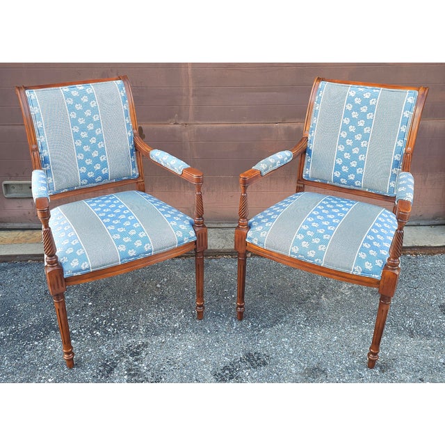 Pair of French Directoire Style Carved Walnut and Upholstered Armchairs. A replica of the 18th Century French Directoire...