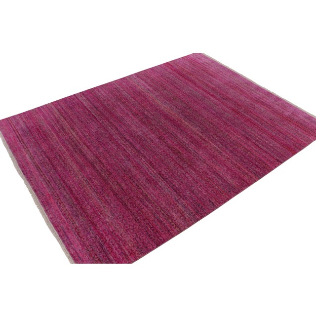 From Rug & Kilim’s bold modern works, an inventive 9x12 take on plain rugs, hand-knotted in a luxurious wool & silk. On...