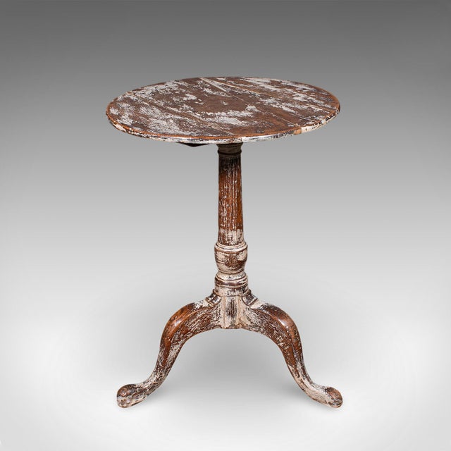 This is an antique pedestal table. An English, painted oak side or lamp table, dating to the Georgian period, circa 1750....