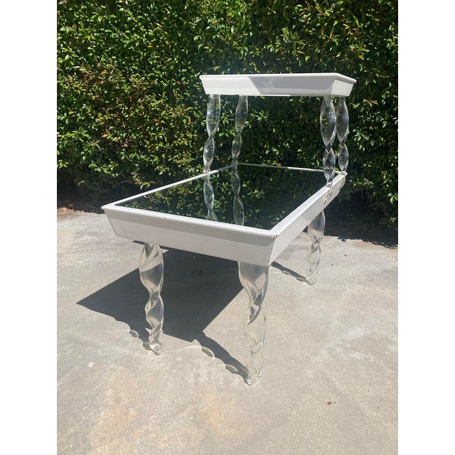 An iconic slice of Hollywood Regency history. This two-tiered end table was designed by Lorin Jackson for Grosfeld House's...