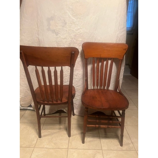 Set of six (6) Cattail back dining chairs in tiger oak.
