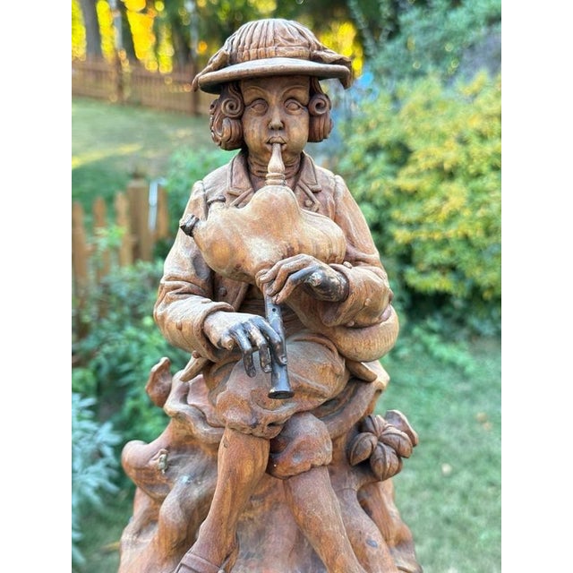 Antique Wood Sculpture depicting a traveling bagpipe player, c.18thC-early 19thC. Highly skilled & expressive...