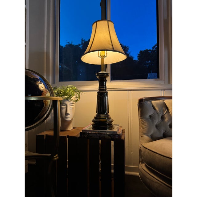 A striking pair of vintage Stiffel solid brass table lamps with classic Hollywood Regency presence and timeless...