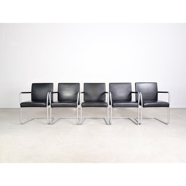 We are offering a beautiful set of five Walter Knoll dining chairs in black leather for sale. The version offered here is...