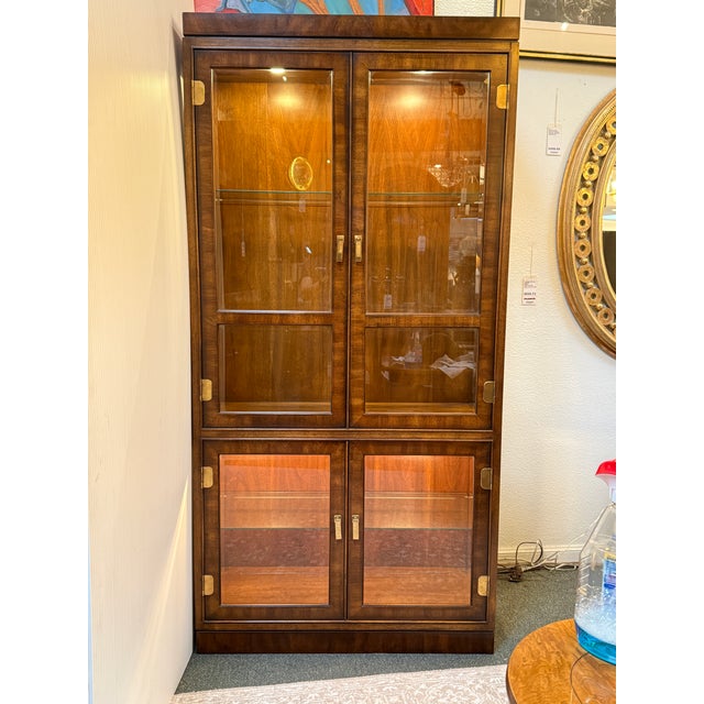 Design Plus Gallery presents a Curio Cabinet of the Dynasty Collection by Drexel Heritage. "Dynasty by Heritage" primarily...