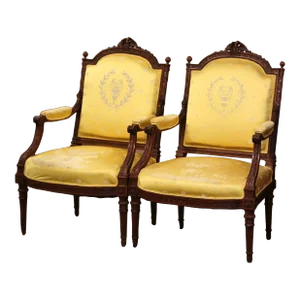 Pair of 19th Century French Louis XVI Walnut Fauteuils With Eagle Crest