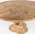 Exceptional round rattan dining table. Legs representing a palmtree, top with palms patterns covered with a glass top....