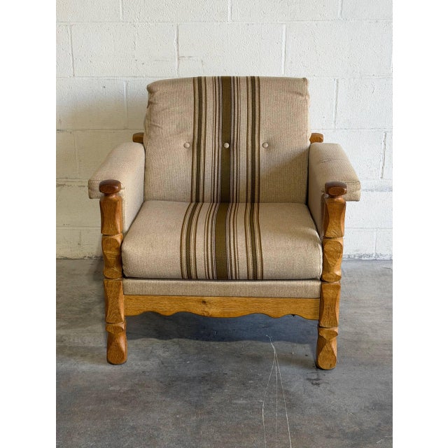 This plush lounge chair features carved stacked corner posts, scalloped aprons, and deep cushioning. Its traditional...
