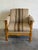 This plush lounge chair features carved stacked corner posts, scalloped aprons, and deep cushioning. Its traditional...
