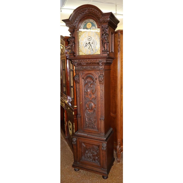 19th Century Tiger Oak Figural Carved Tall Case Grandfather Clock W&H Movement Dimensions : 94" Tall X 23" Wide X 16" Deep...