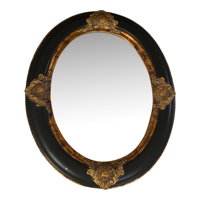 Vintage Oval Convex Mirror With Black and Gold Ornate Wooden Frame. For Sale