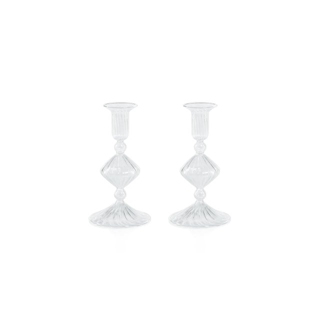 Illuminate your space with this exquisite clear glass taper candle holder, featuring a captivating bell-inspired cup...