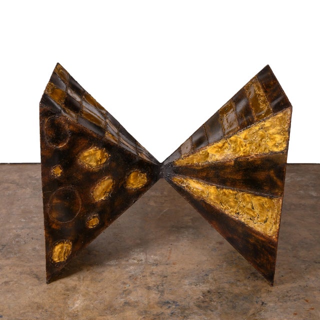 Bow-tie dining table from the Sculptured Metal series made for Directional in 1970. A variation of this design is...