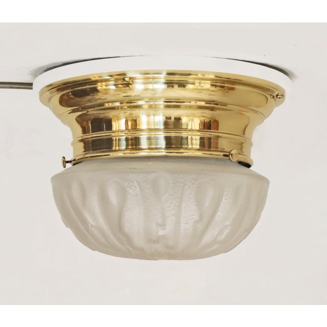 Art Nouveau – Art Deco Ceiling Lamp Brass ceiling lamp made around 1915/20. Step-shaped brass body mounted on a white...