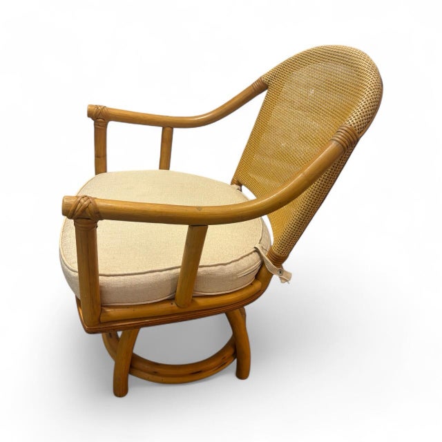 Rattan Set - 3 Vintage Sturdy Rattan Low Back Swivel Chairs and Matching 42" round Table is a stylish and unique addition...